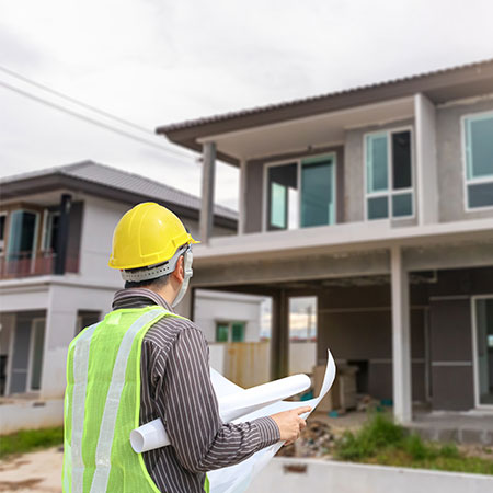 Engineer Looking Over House